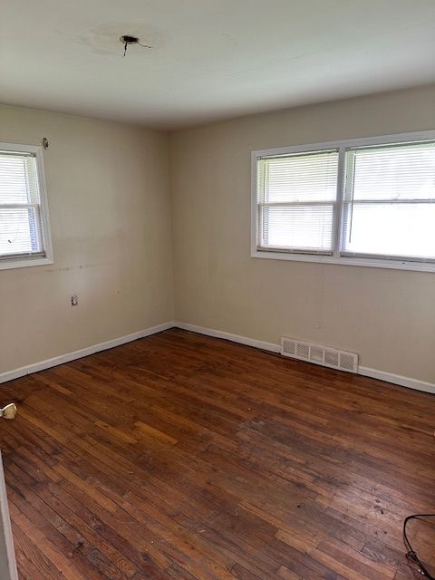 21383 Mada Ave, Southfield, MI 48075 - spare room with hardwood / wood-style flooring and baseboards