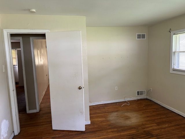 21383 Mada Ave, Southfield, MI 48075 - empty room with wood finished floors and baseboards