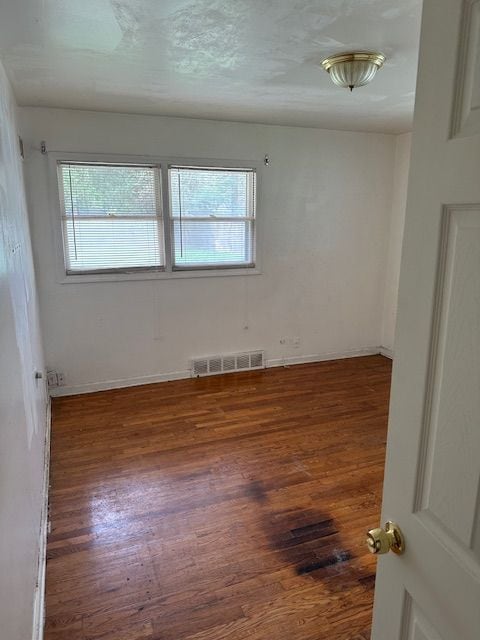 21383 Mada Ave, Southfield, MI 48075 - unfurnished room featuring wood finished floors and baseboards