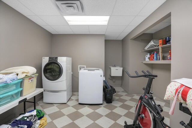 1355 W Buell Rd, Oakland, MI 48363 - washroom with washer and clothes dryer and light floors