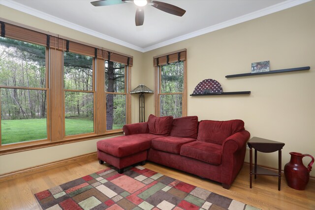 1355 W Buell Rd, Oakland, MI 48363 - living room featuring wood finished floors, ceiling fan, ornamental molding, and baseboards