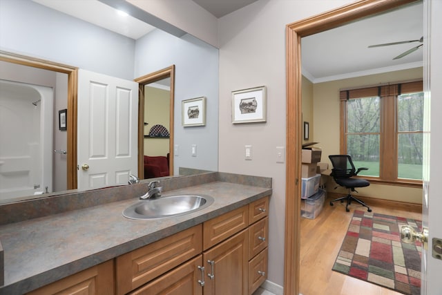 1355 W Buell Rd, Oakland, MI 48363 - full bath with wood finished floors, vanity, and ornamental molding