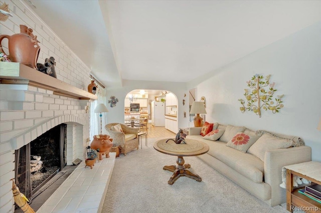 5116 Mohr Valley Ln, Bloomfield Hills, MI 48304 - carpeted living area with arched walkways and a brick fireplace