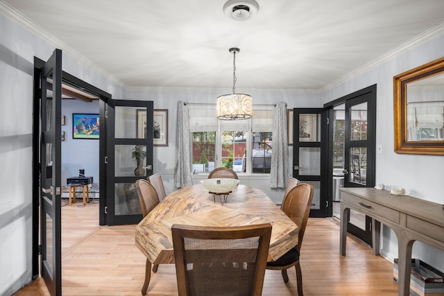 14240 Rosemont Ave, Detroit, MI 48223 - dining area featuring french doors, plenty of natural light, a chandelier, light wood-type flooring, and ornamental molding