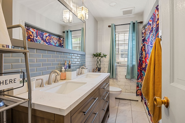 14240 Rosemont Ave, Detroit, MI 48223 - bathroom with toilet, marble finish floors, double vanity, and a chandelier
