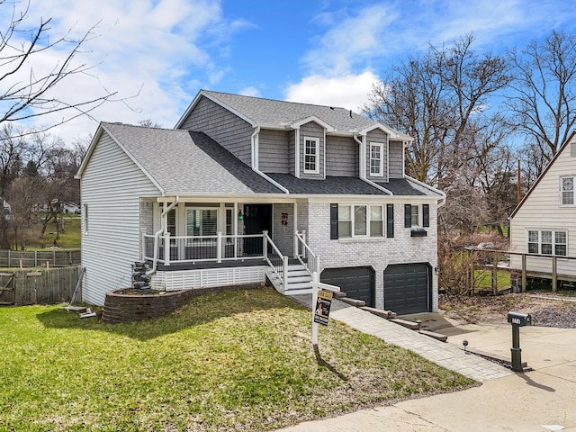 576 E Flint St, Lake Orion, MI 48362 - traditional-style house with covered porch, an attached garage, concrete driveway, roof with shingles, and brick siding