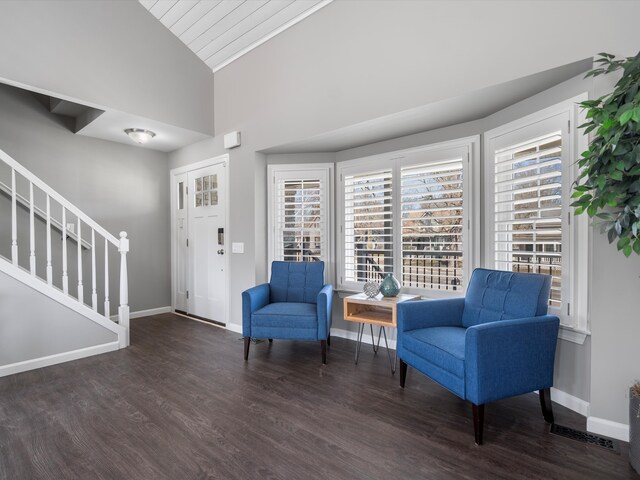 576 E Flint St, Lake Orion, MI 48362 - sitting room with vaulted ceiling, wood finished floors, baseboards, and stairs