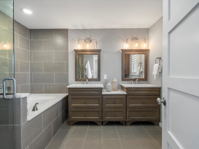 576 E Flint St, Lake Orion, MI 48362 - bathroom with double vanity, tile patterned floors, a bath, and a shower with door