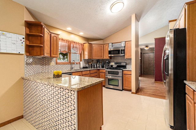 1658 Ridgeview Ct, Ludington, MI 49431 - kitchen with stainless steel appliances, a peninsula, a sink, open shelves, and backsplash