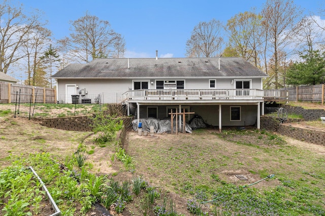 1658 Ridgeview Ct, Ludington, MI 49431 - back of property featuring a wooden deck and a fenced backyard