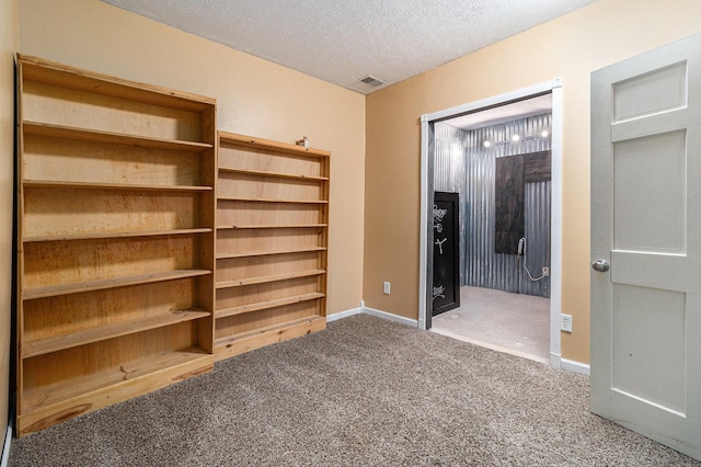 1658 Ridgeview Ct, Ludington, MI 49431 - unfurnished bedroom with carpet and a textured ceiling