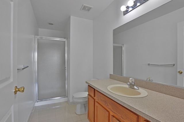 bathroom featuring a shower stall, toilet, tile patterned floors, and vanity