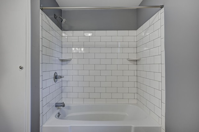 bathroom with shower / washtub combination