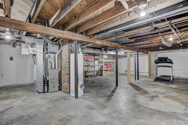 below grade area featuring water heater and heating unit