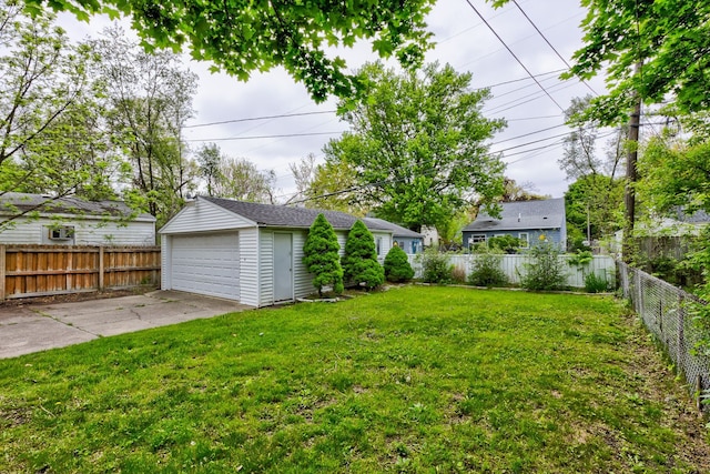 view of yard featuring an outbuilding and a garage
