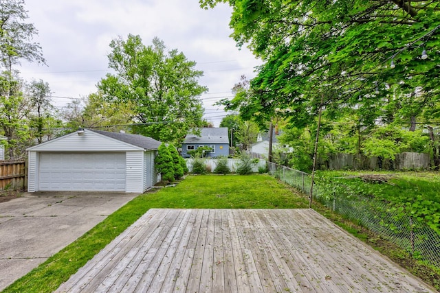 deck with a detached garage and an outbuilding