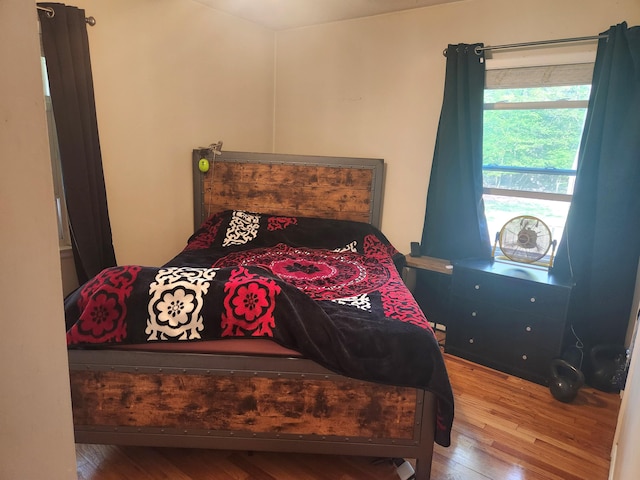 bedroom with wood finished floors