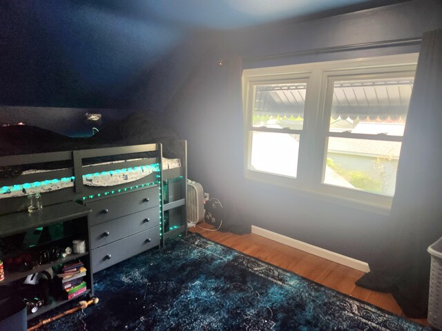 bedroom featuring wood finished floors