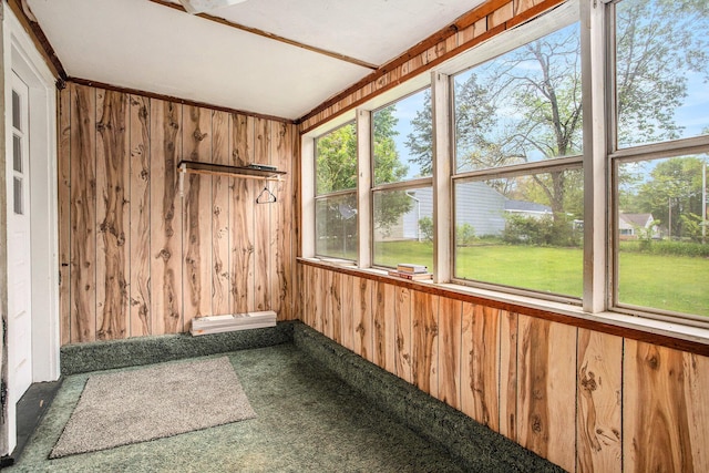 8 Vernon Ave, Battle Creek, MI 49014 - unfurnished sunroom featuring wood walls, healthy amount of natural light, and carpet floors