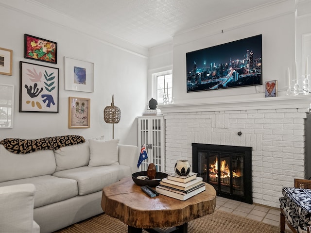 living area with a brick fireplace, crown molding, and light tile patterned floors