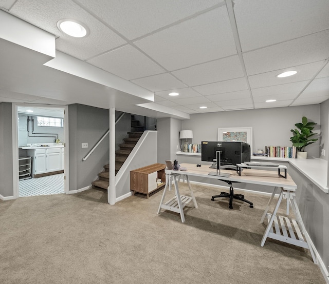 office featuring light colored carpet, baseboards, recessed lighting, and a drop ceiling