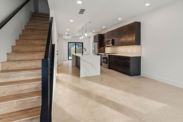 5234 Avery St, Detroit, MI 48208 - kitchen featuring appliances with stainless steel finishes, modern cabinets, recessed lighting, an island with sink, and decorative light fixtures