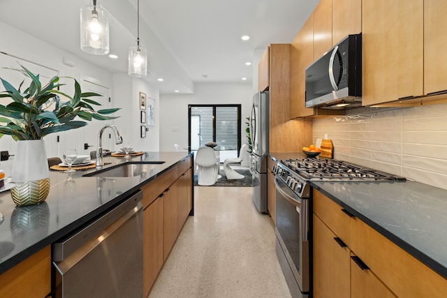 5234 Avery St, Detroit, MI 48208 - kitchen featuring appliances with stainless steel finishes, a sink, dark stone counters, tasteful backsplash, and dark aggregate flooring