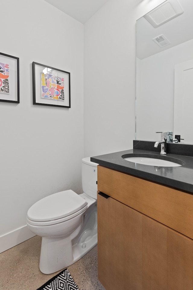 5234 Avery St, Detroit, MI 48208 - half bathroom with toilet, speckled floor, vanity, and baseboards