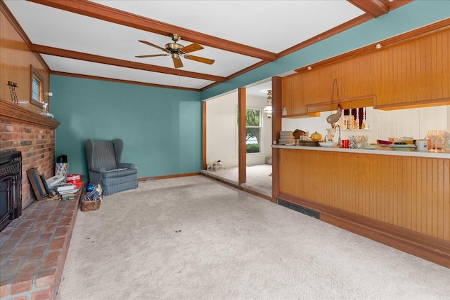 2020 NW Ave, Lansing, MI 48906 - kitchen featuring a ceiling fan, carpet floors, crown molding, and beam ceiling