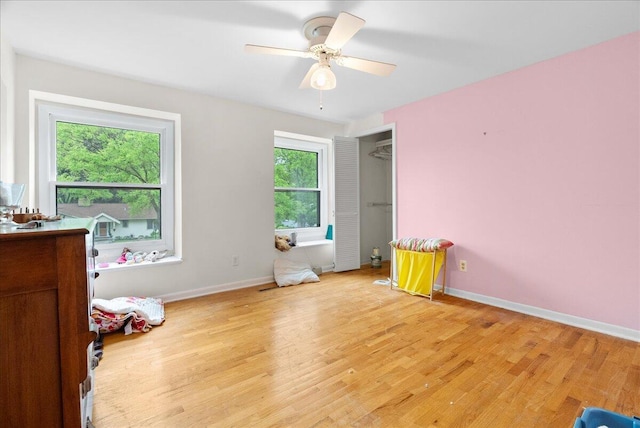 2020 NW Ave, Lansing, MI 48906 - bedroom featuring light wood-style flooring, baseboards, and a ceiling fan