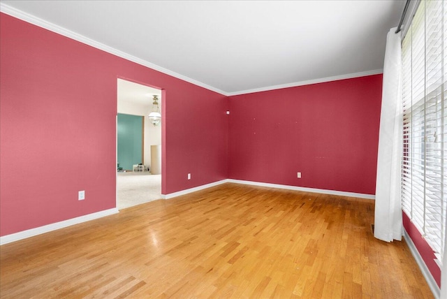 2020 NW Ave, Lansing, MI 48906 - unfurnished bedroom featuring wood finished floors, baseboards, and ornamental molding