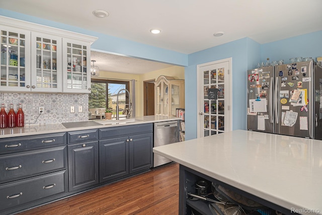 5361 Lin Hill Dr, Swartz Creek, MI 48473 - kitchen featuring appliances with stainless steel finishes, a sink, dark wood-style flooring, white cabinetry, and light countertops