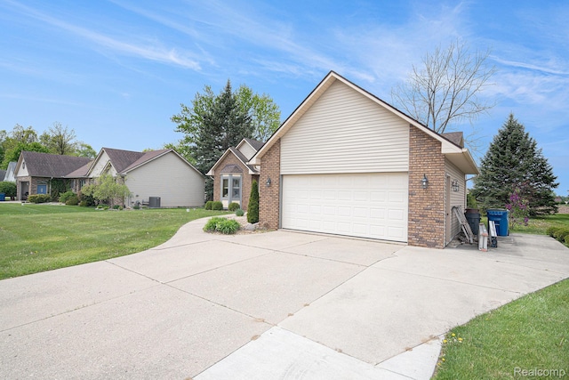 5361 Lin Hill Dr, Swartz Creek, MI 48473 - ranch-style house featuring brick siding, concrete driveway, a front yard, and a garage