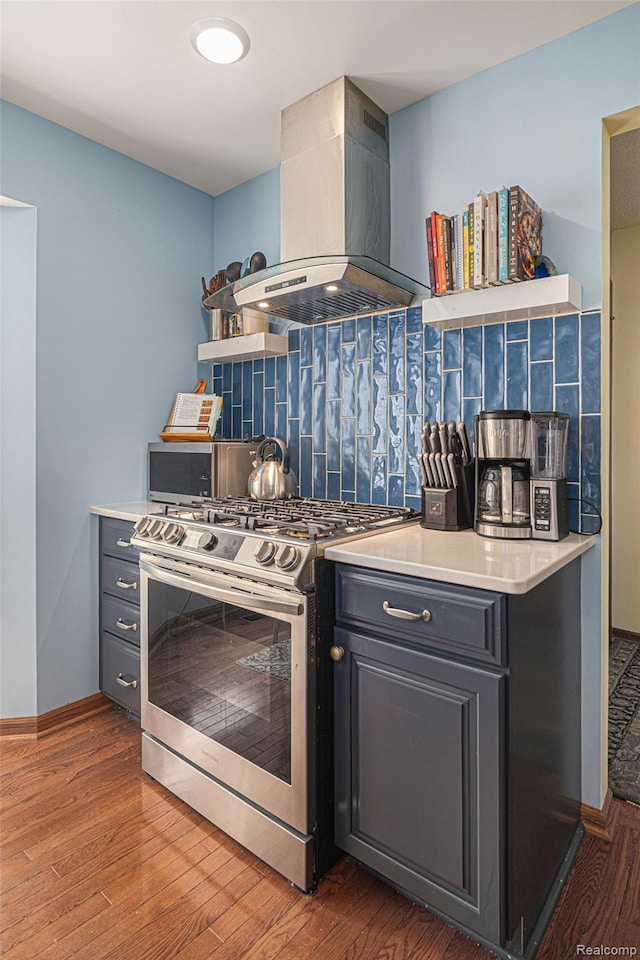 5361 Lin Hill Dr, Swartz Creek, MI 48473 - kitchen featuring gas stove, ventilation hood, decorative backsplash, light wood-style flooring, and open shelves