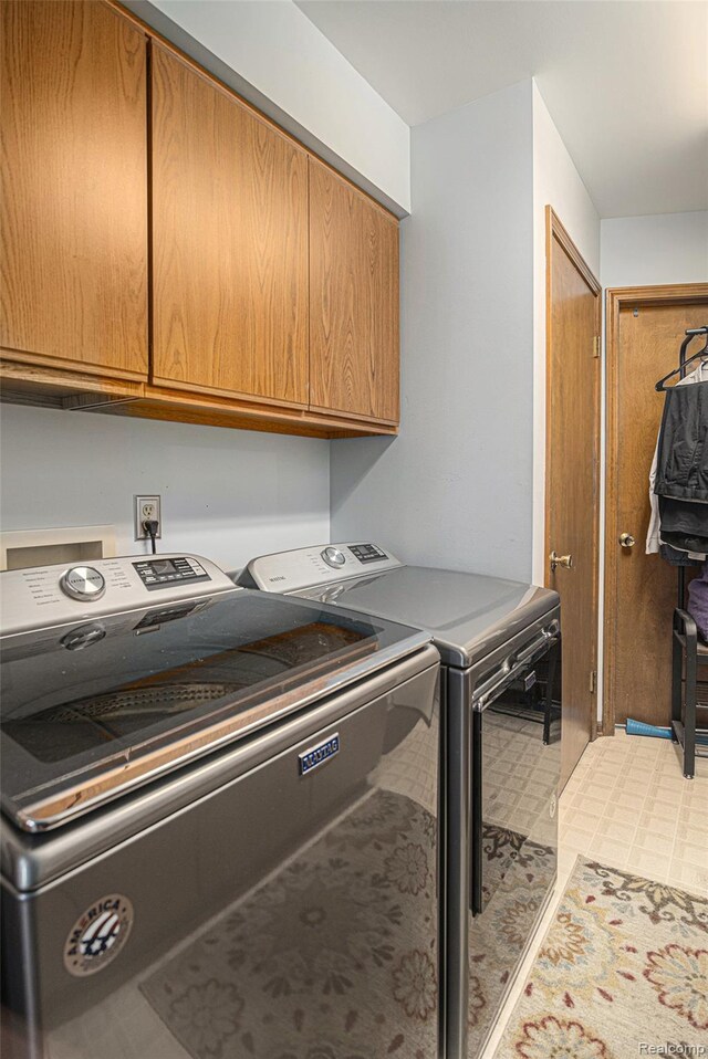 5361 Lin Hill Dr, Swartz Creek, MI 48473 - laundry room with cabinet space, independent washer and dryer, and light floors