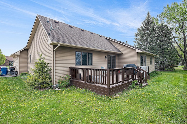 5361 Lin Hill Dr, Swartz Creek, MI 48473 - back of property with a shingled roof, a deck, and a lawn