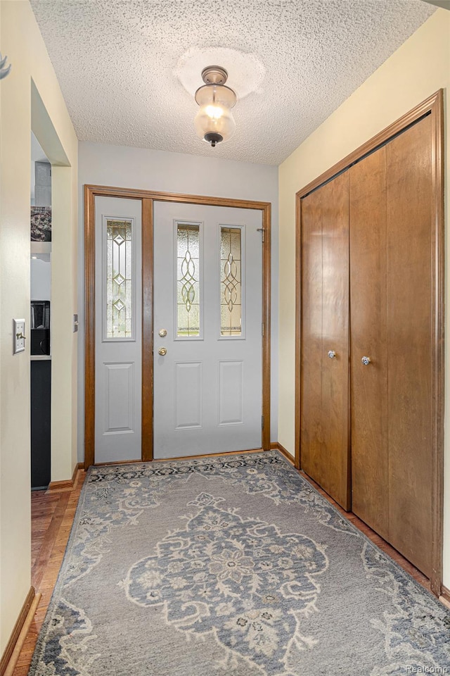 5361 Lin Hill Dr, Swartz Creek, MI 48473 - foyer with baseboards and a textured ceiling