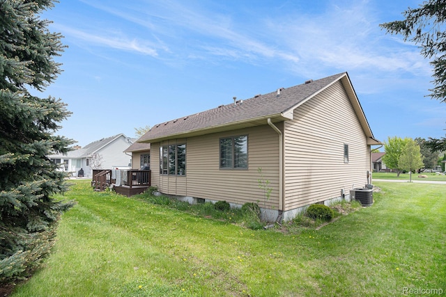 5361 Lin Hill Dr, Swartz Creek, MI 48473 - view of property exterior with a deck, a yard, and cooling unit