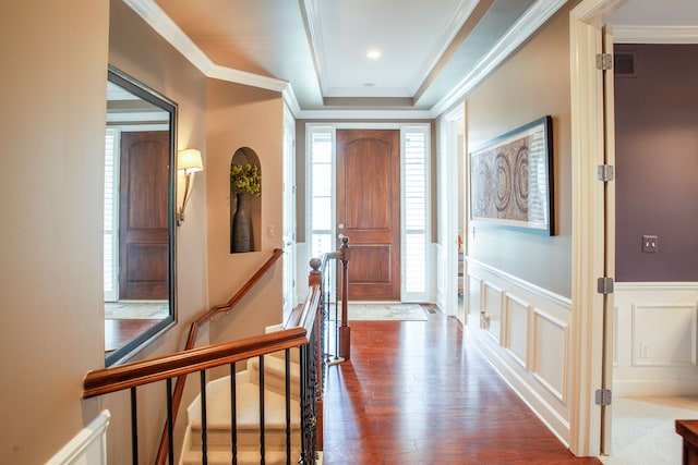 5514 Woodfall Rd, Clarkston, MI 48348 - entryway featuring dark wood-type flooring, a decorative wall, crown molding, and a wainscoted wall