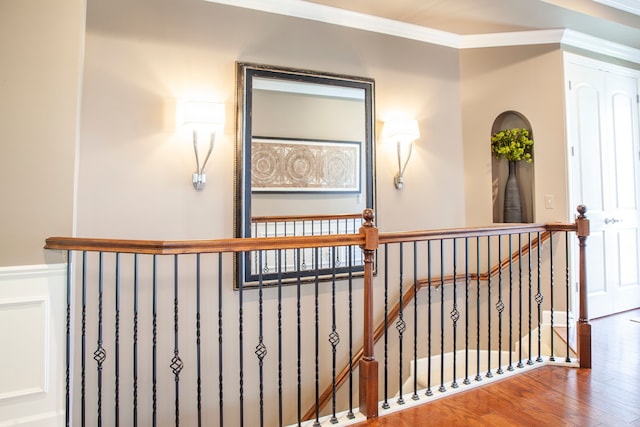 5514 Woodfall Rd, Clarkston, MI 48348 - stairs with wainscoting, wood finished floors, and ornamental molding