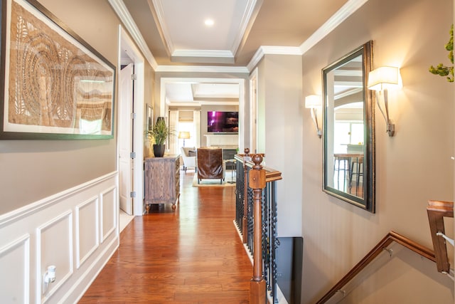 5514 Woodfall Rd, Clarkston, MI 48348 - hall featuring an upstairs landing, ornamental molding, wood finished floors, a wainscoted wall, and a decorative wall