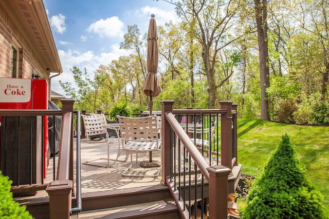 5514 Woodfall Rd, Clarkston, MI 48348 - deck featuring outdoor dining area and a lawn