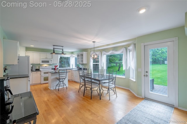 105 Crescent Hill Dr, Ortonville, MI 48462 - dining area with light wood-type flooring and baseboards