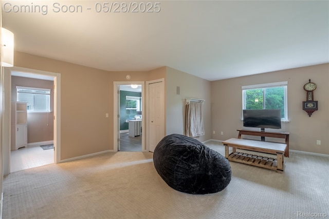 105 Crescent Hill Dr, Ortonville, MI 48462 - living area featuring light carpet and baseboards