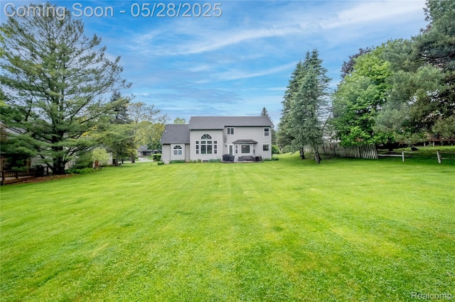 105 Crescent Hill Dr, Ortonville, MI 48462 - back of house featuring stucco siding