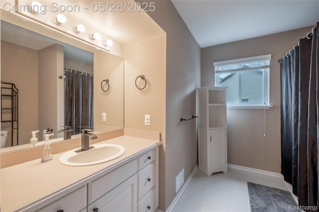 105 Crescent Hill Dr, Ortonville, MI 48462 - bathroom with vanity, baseboards, toilet, and tile patterned floors