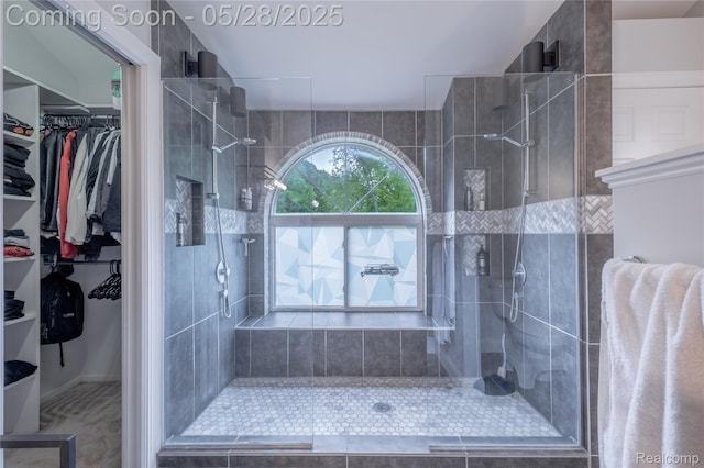 105 Crescent Hill Dr, Ortonville, MI 48462 - bathroom with a tile shower and a walk in closet