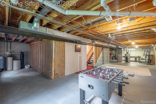 105 Crescent Hill Dr, Ortonville, MI 48462 - unfinished below grade area featuring a water softener, stairs, and water heater