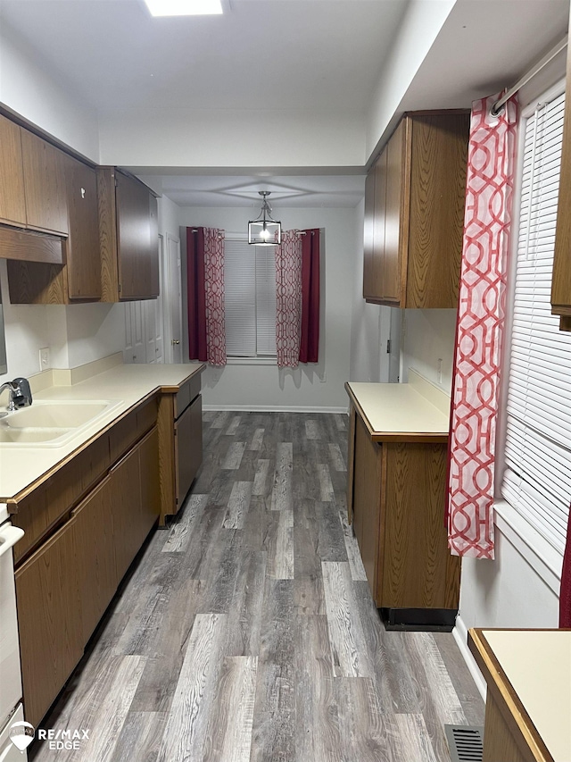 1132 Wisner St, Mount Morris, MI 48458 - kitchen with dark wood-type flooring, light countertops, and ceiling fan