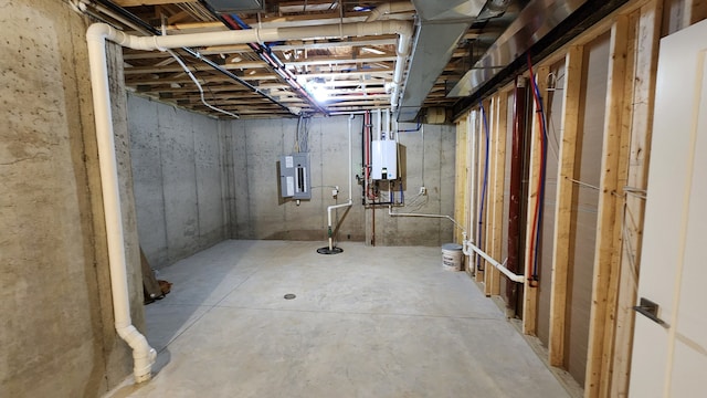unfinished basement featuring electric panel and water heater